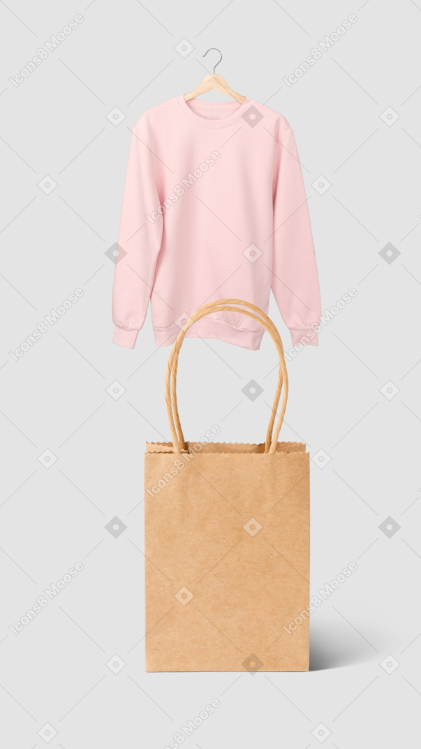 Pink sweatshirt and paper bag