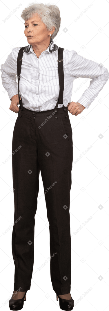 Front view of an old lady in office clothing adjusting her trousers