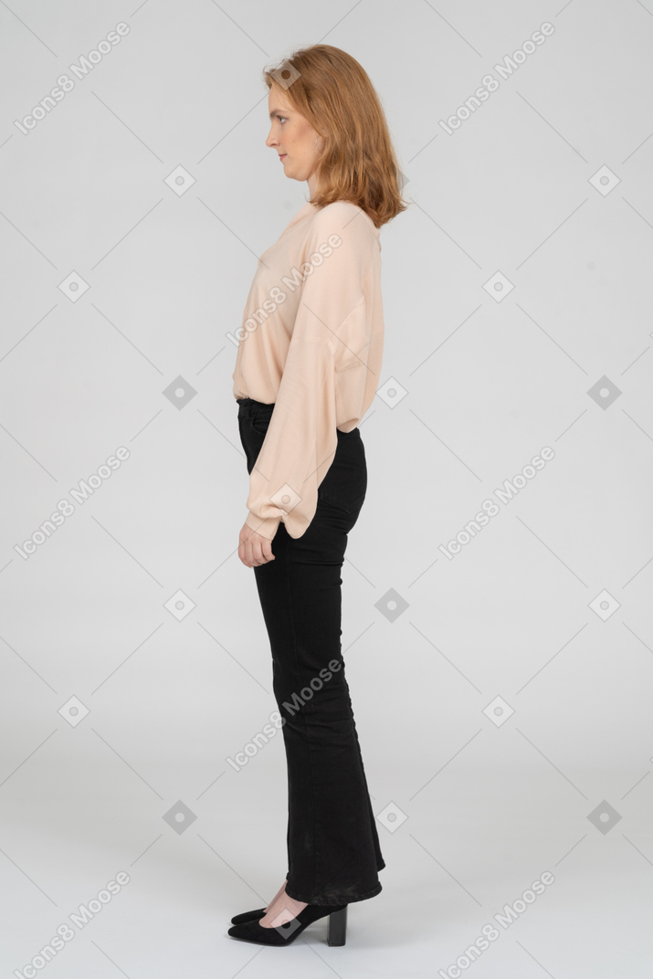 Side view of young woman looking straight