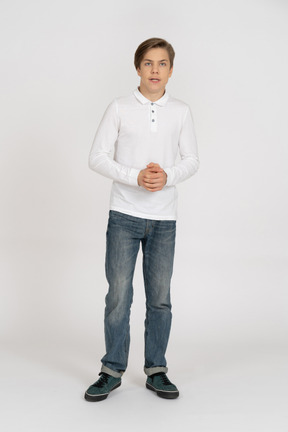 Young man in casual clothes standing