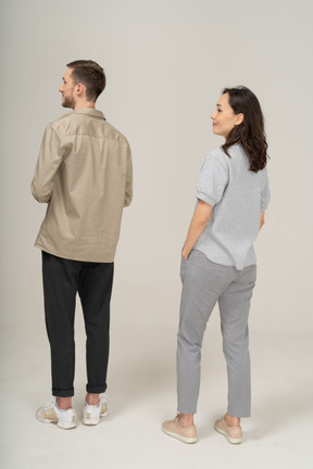 Three-quarter back view of young couple