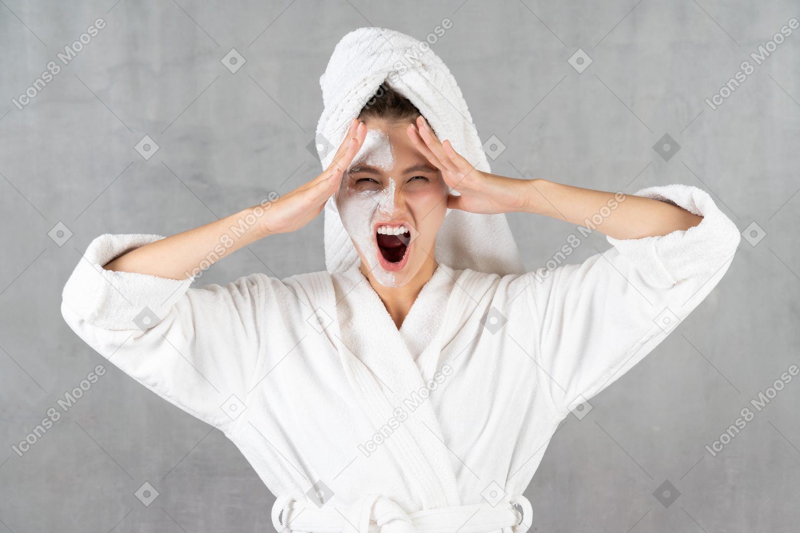 Young woman in bathrobe shouting