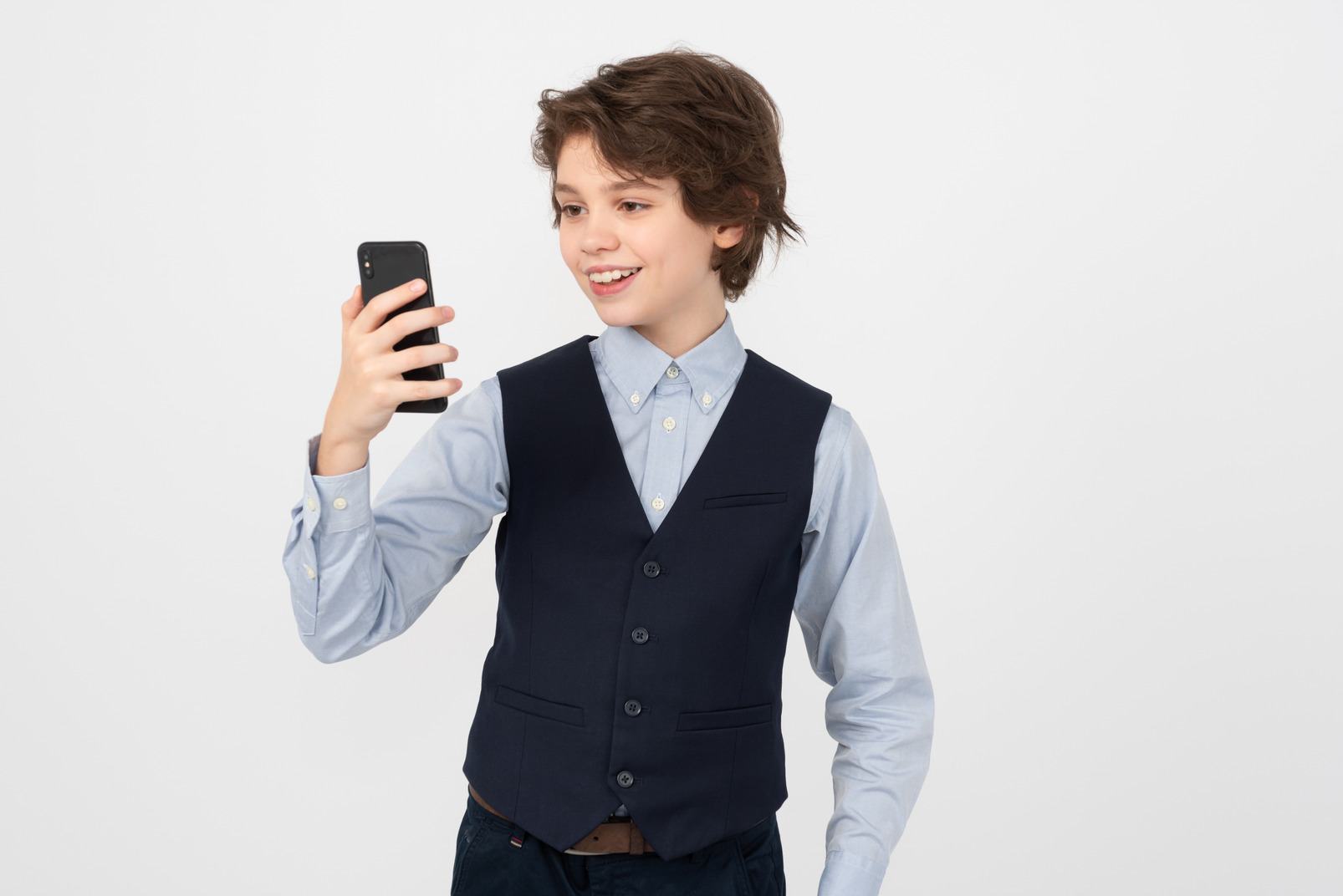 Schoolboy making a selfie on his smartphone