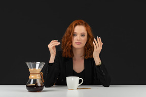 Cute woman having a coffee break