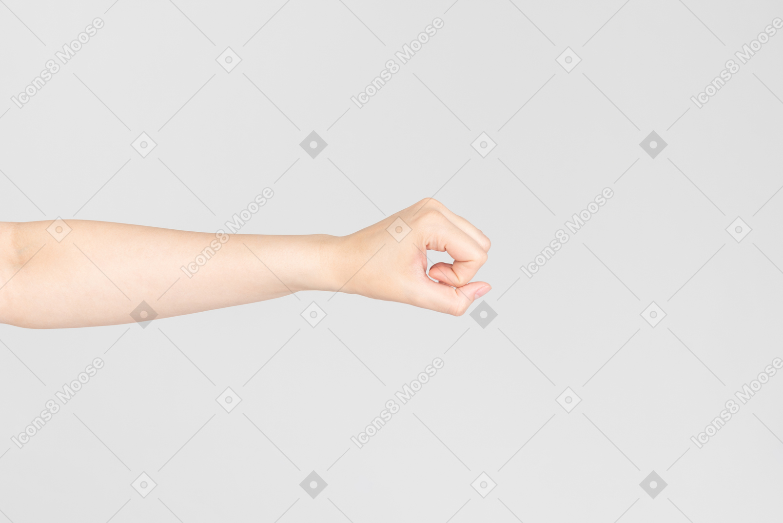 Side look of female hand almost clenched in a fist