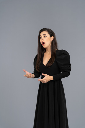Three-quarter view of an opera female singer in black dress