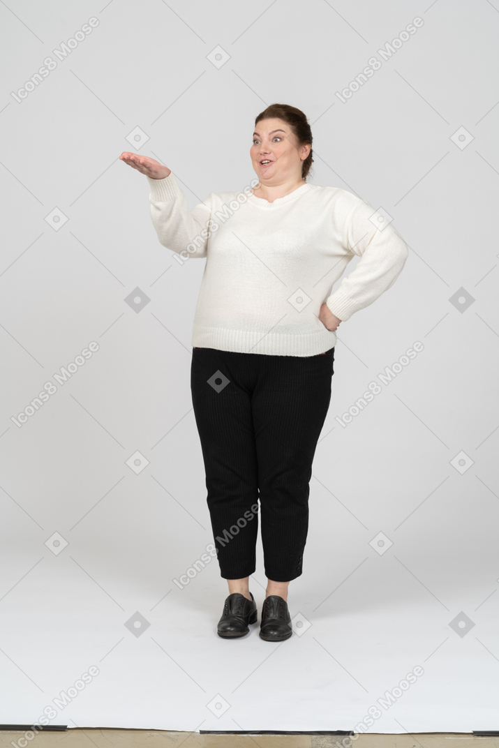 Front view of a plump woman in casual clothes posing