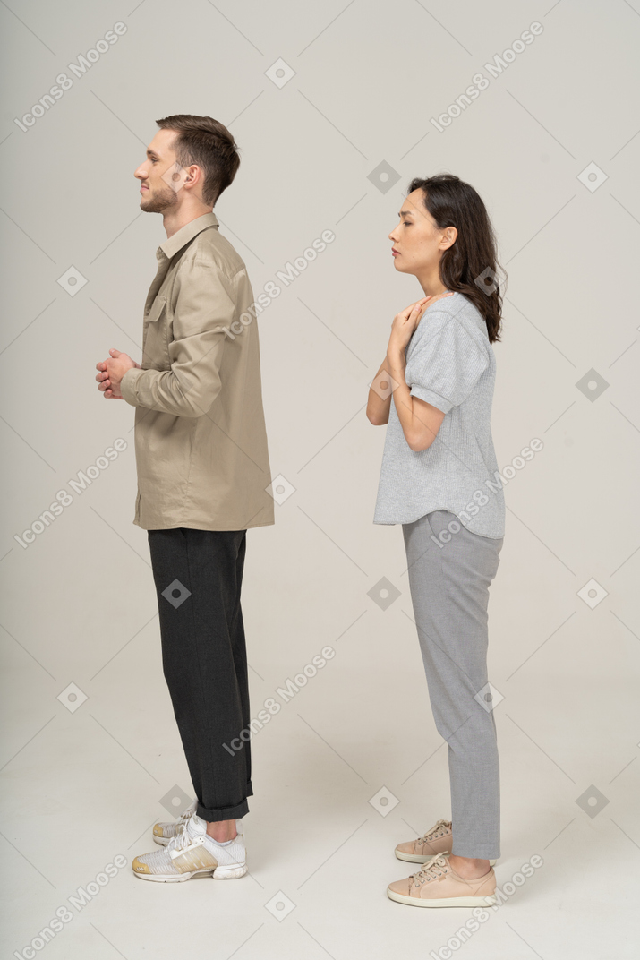 Side view of young couple standing