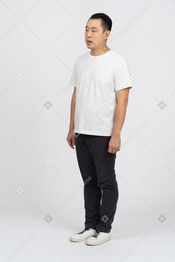 Man in casual clothes licking lips
