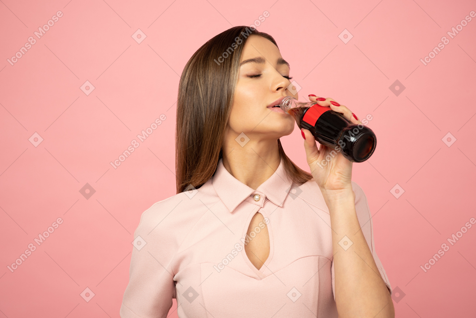 Attractive girl drinking a soda