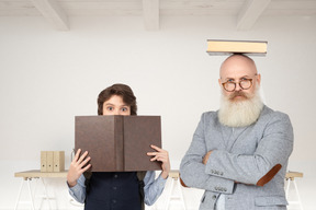 Grandfather and grandson studying together