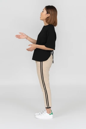 Young woman is looking up