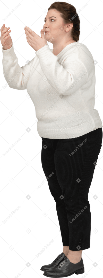Side view of an impressed plump woman in casual clothes