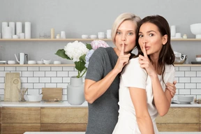 Two women standing in the kitchen