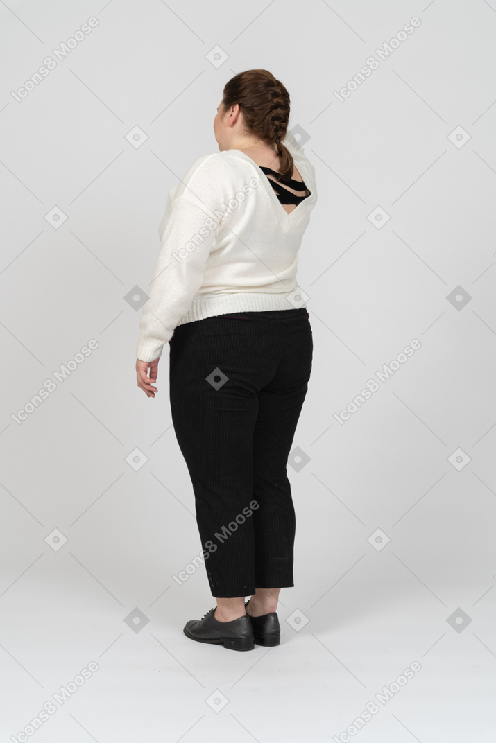 Rear view of plump woman in casual clothes