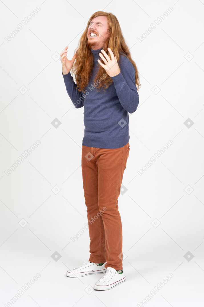 Emotional young man in casual clothes