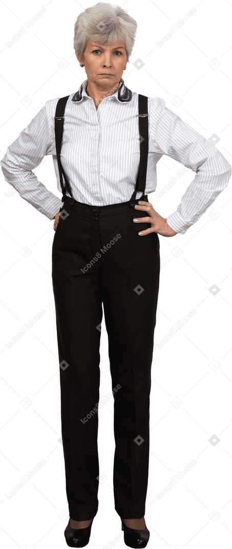 Full-length of an old  perplexed female in suspenders putting hands on hips