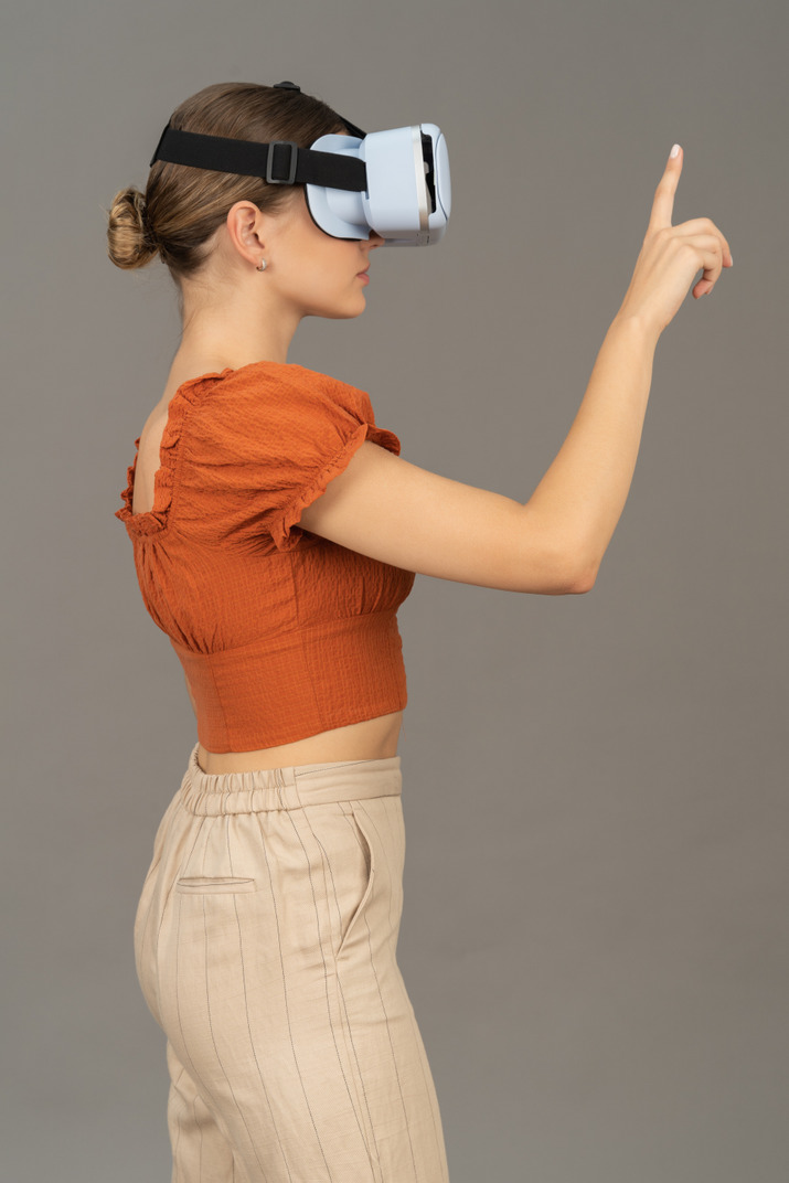 Side view of young woman in vr headset
