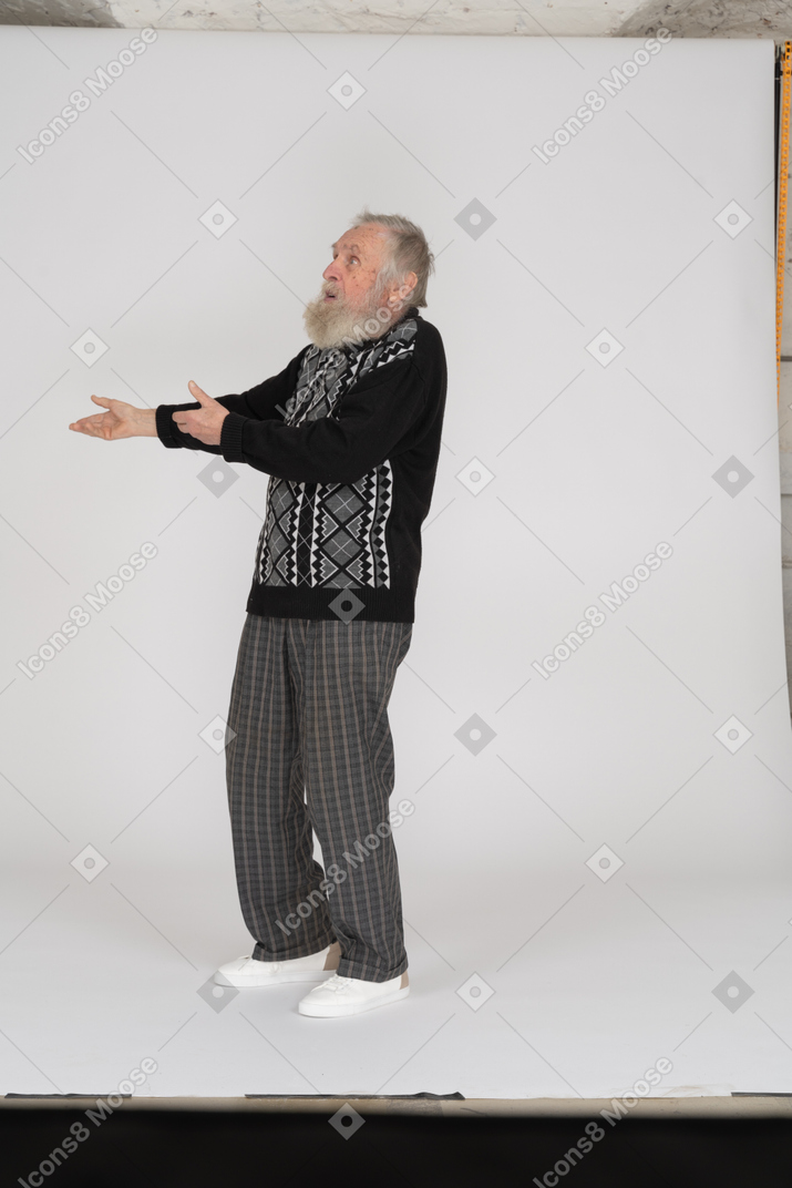 Old man explaining and gesturing