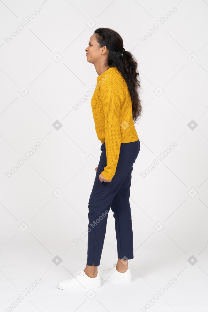 Side view of an angry girl in casual clothes