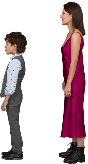Young woman and little boy standing in profile