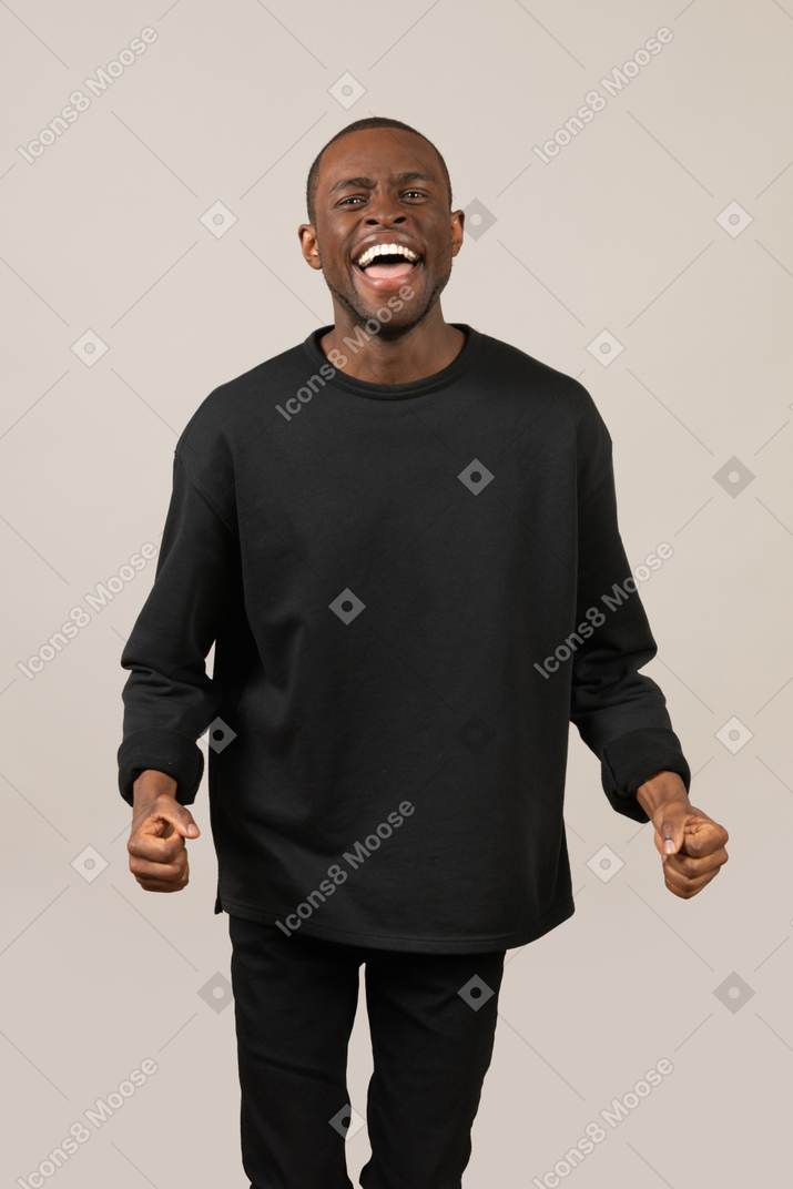 Front view of excited young man
