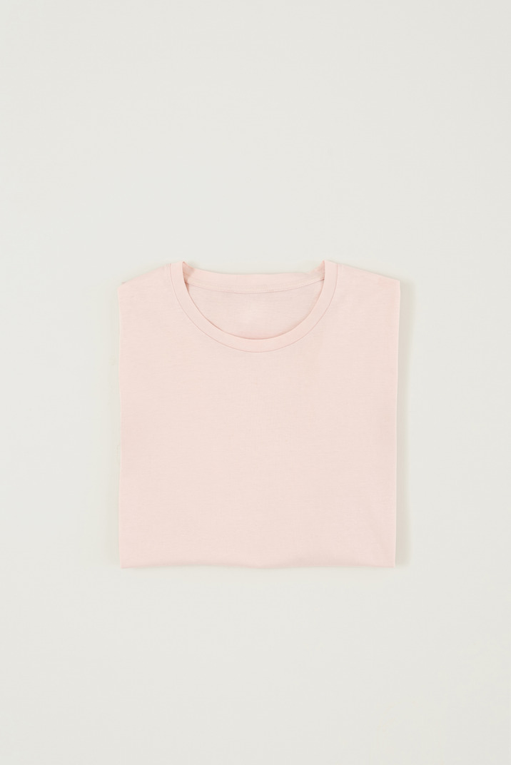 Folded pastel pink t-shirt