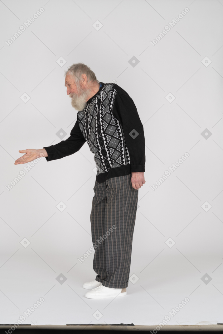 Side view of old man bending down and handshaking