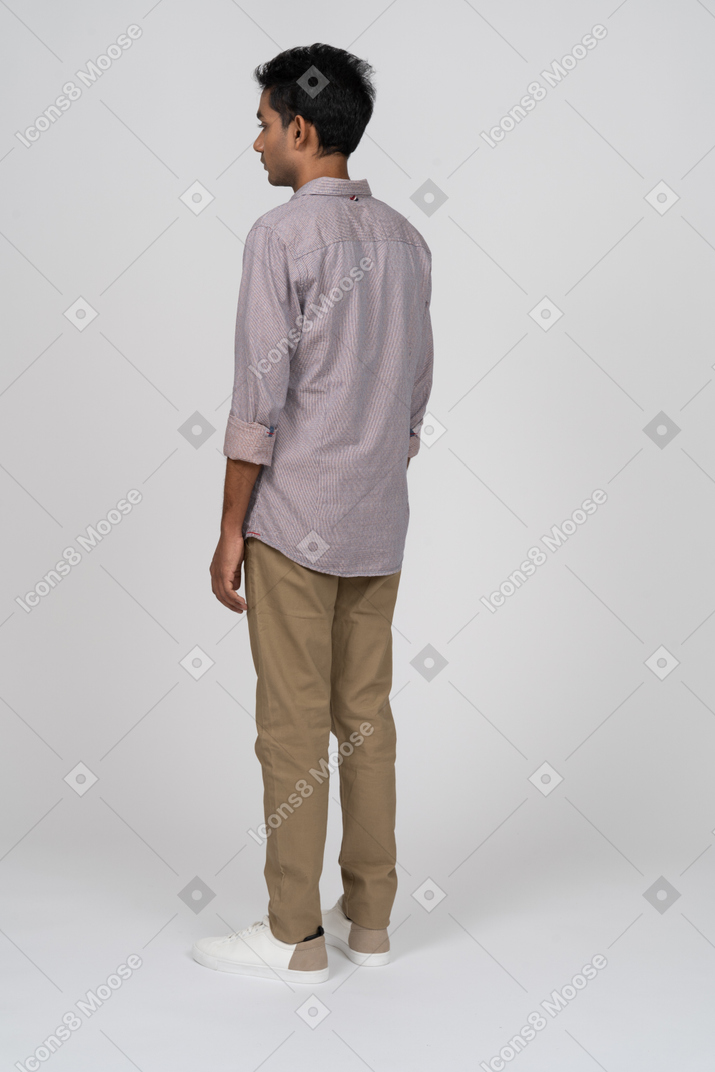 Young man in casual clothes standing