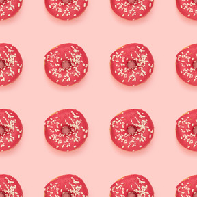 Glazed doughnuts over pink background