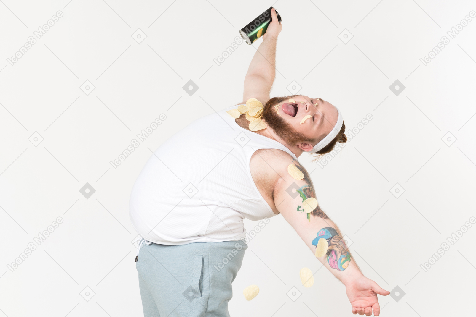 A fat man in sportswear enjoying potato chips