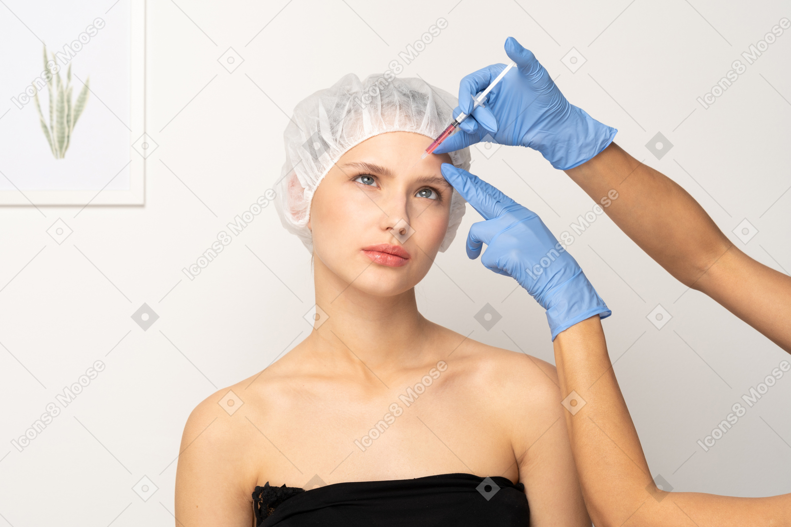 Woman looking uncomfortable during filler injection