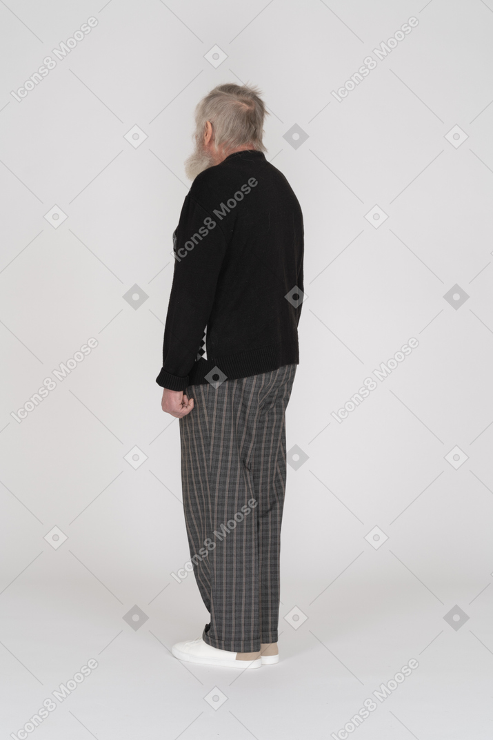 Rear view of old man standing straight