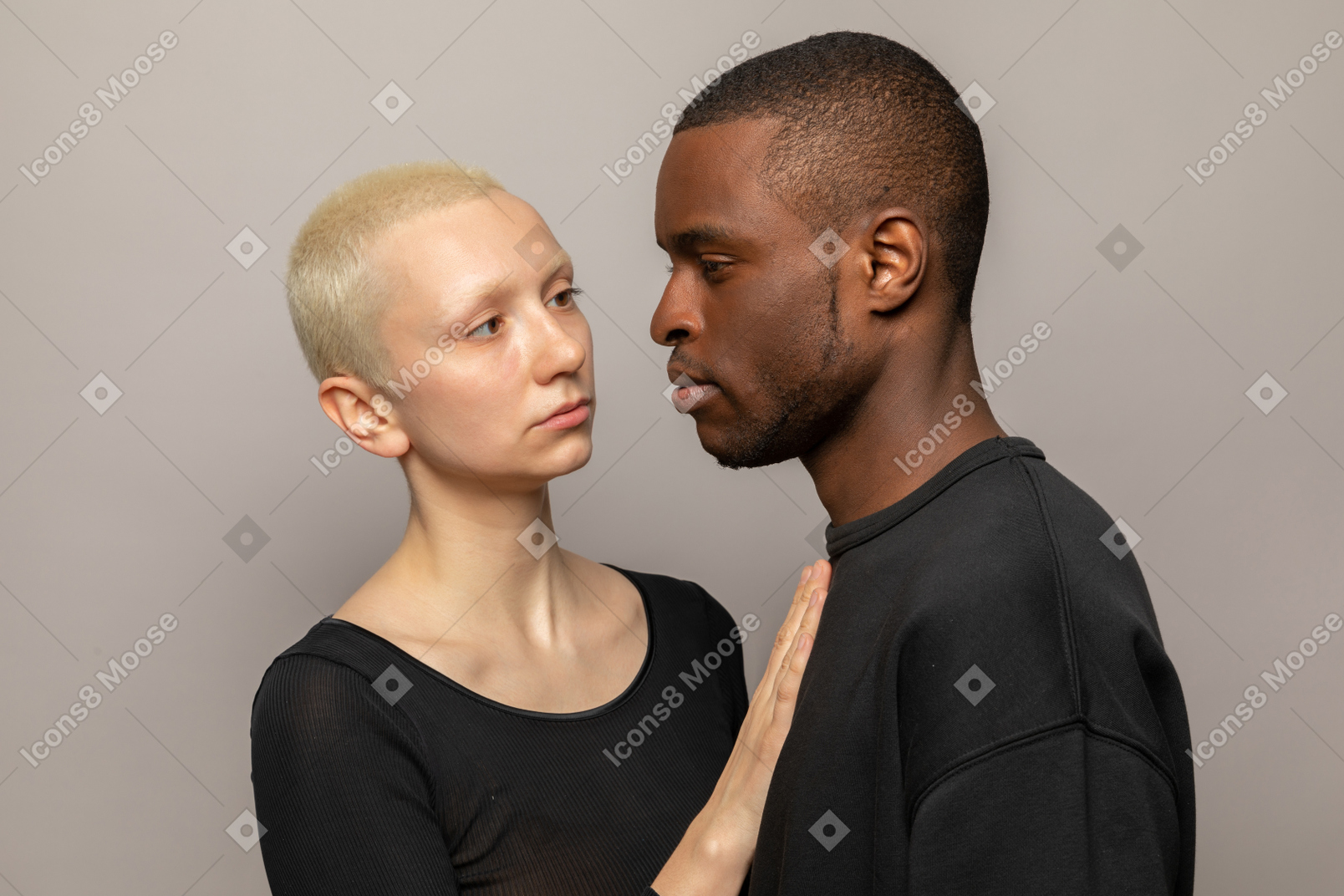 Young woman put her hand on man's chest
