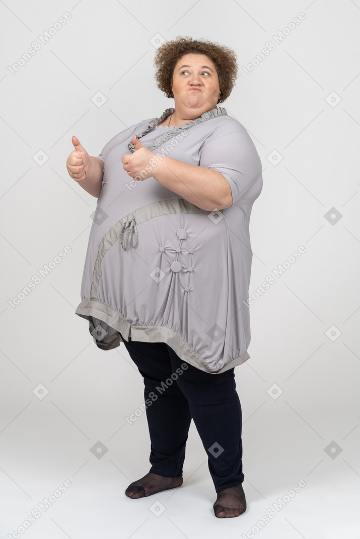 Woman showing thumb up