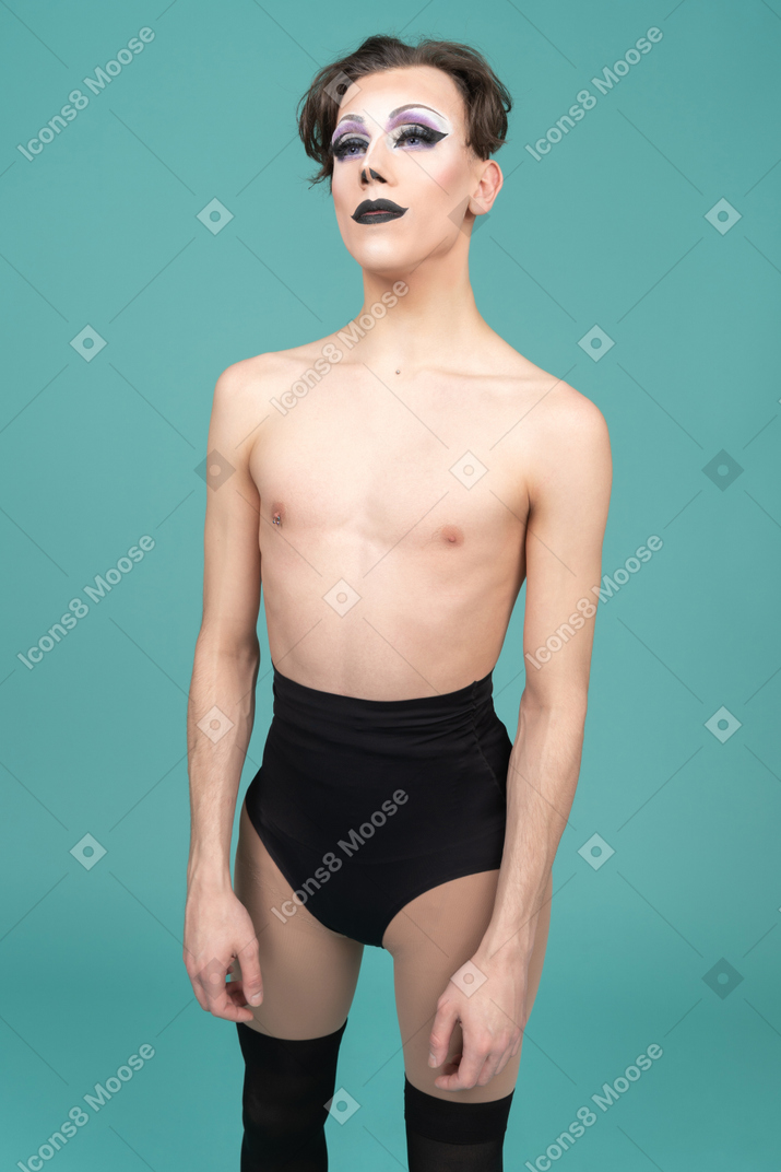 Drag queen standing with arms at sides