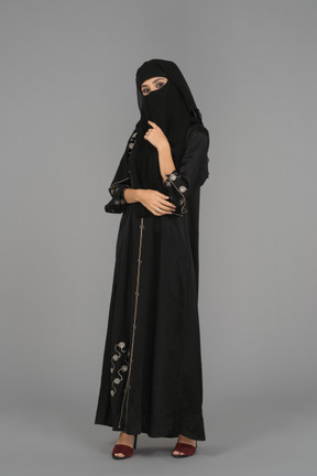 A young muslim woman posing in niqab