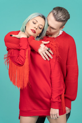 Attractive young man hugging his girlfriend