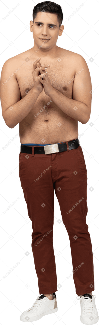 Front view of a shirtless latino man clasping hands together unsurely