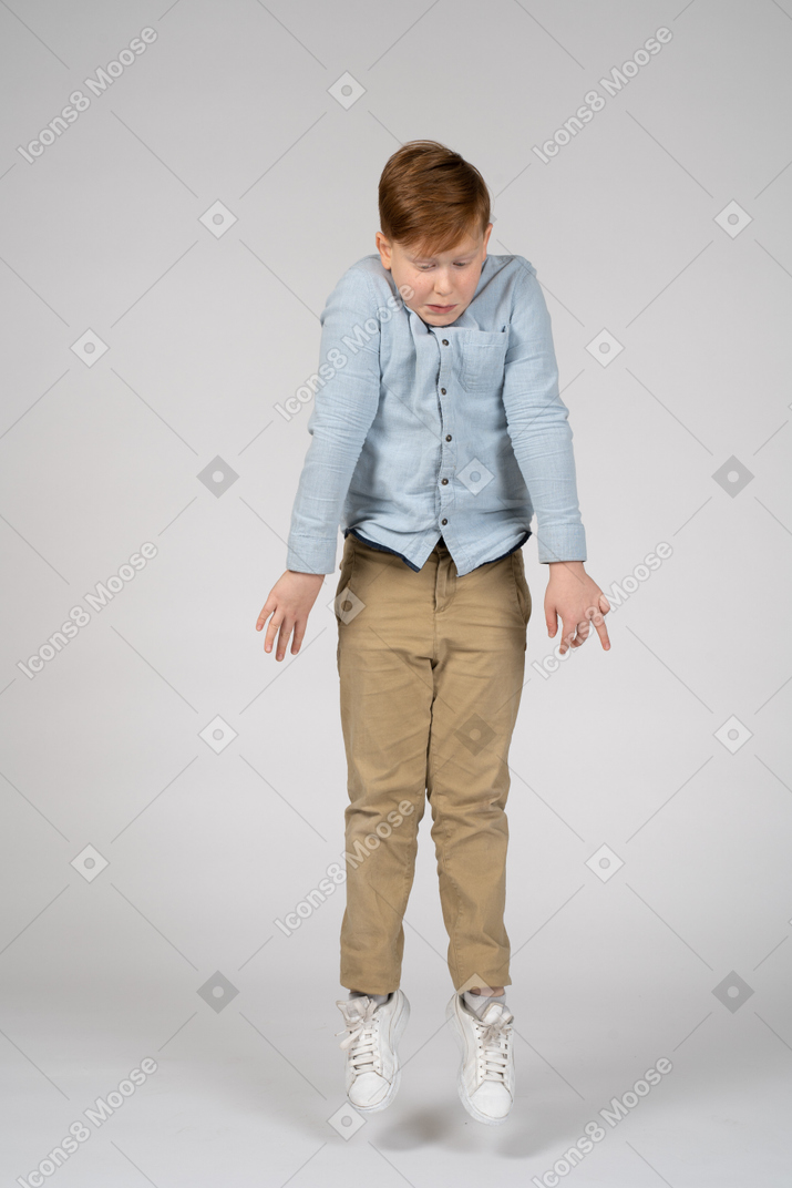 Boy standing in front of a wall