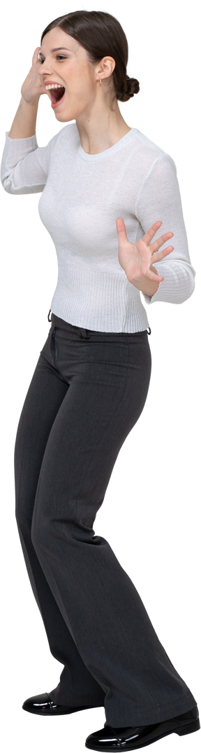 Three-quarter view of a delighted young woman in office clothing