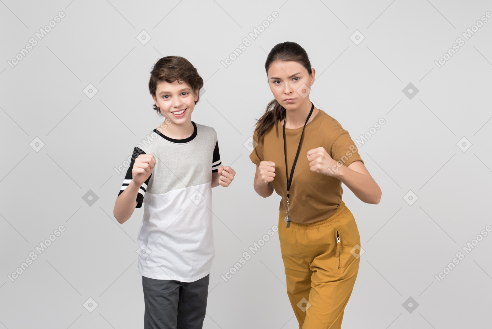 Pe teacher and pupil clenching their fists and feeling powerful