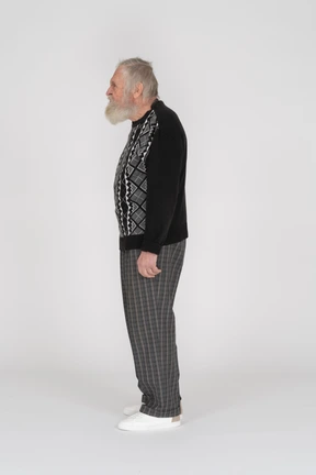 Side view of an old man looking angry