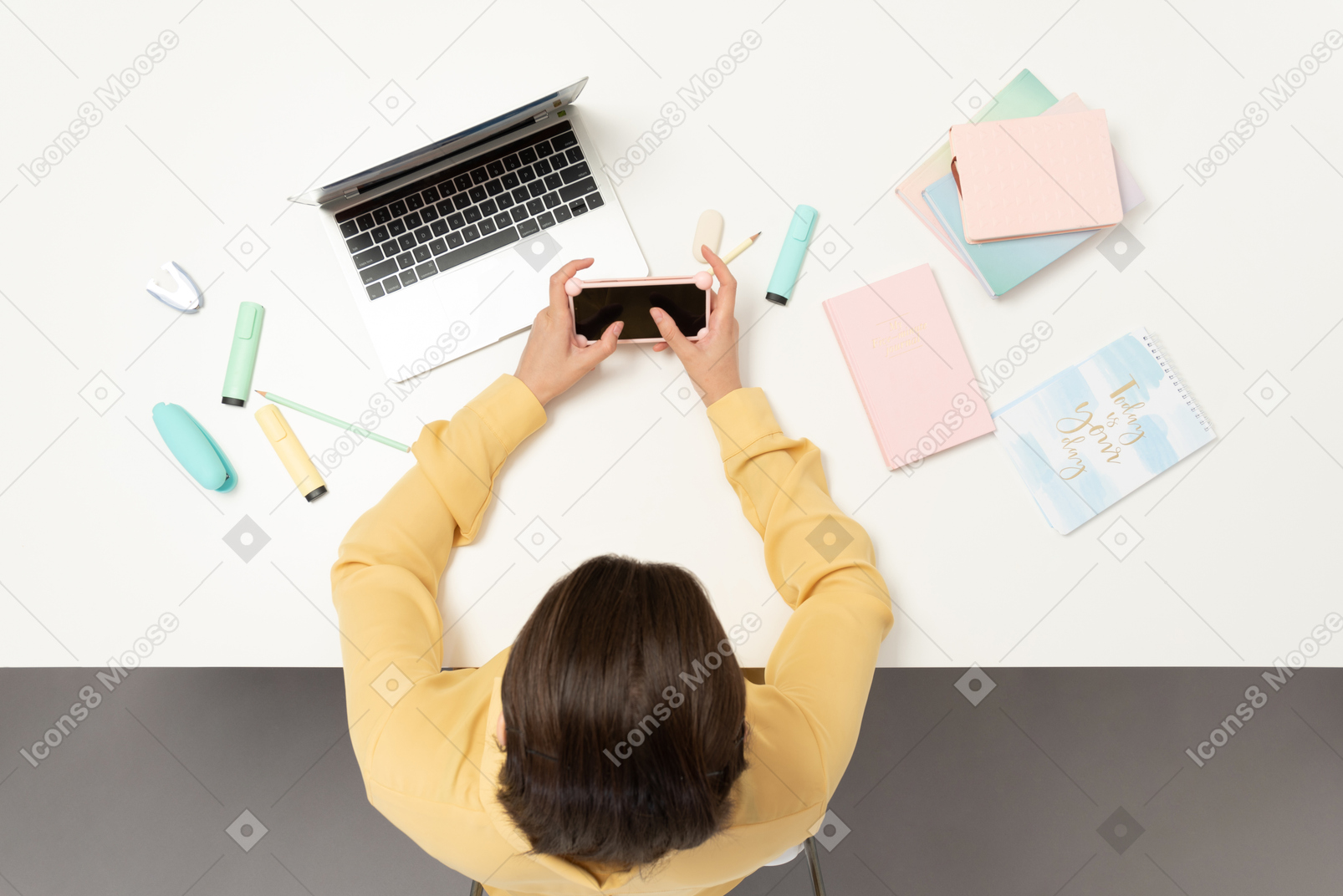 A female office worker holding mobile phone
