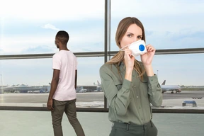 People wearing face masks in the airport