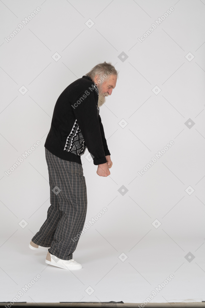 Old man pretending to carry something