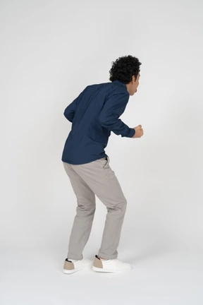 Man in casual clothes posing in profile