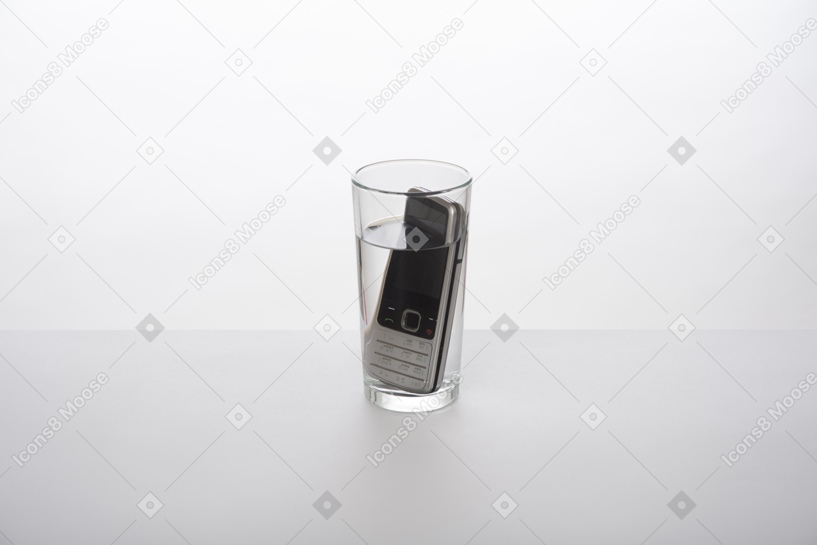 Cell phone in a glass of water