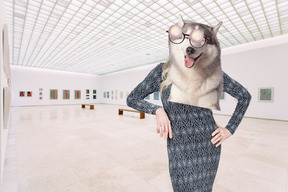 A woman wearing a dog mask in a museum
