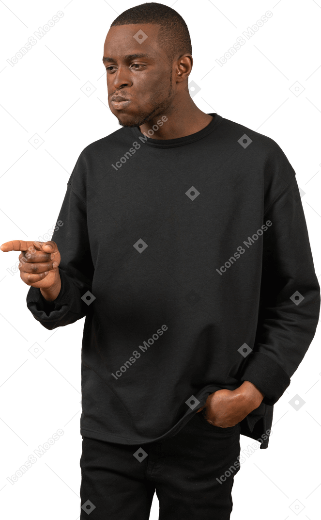 Man puffing cheeks and pointing at something